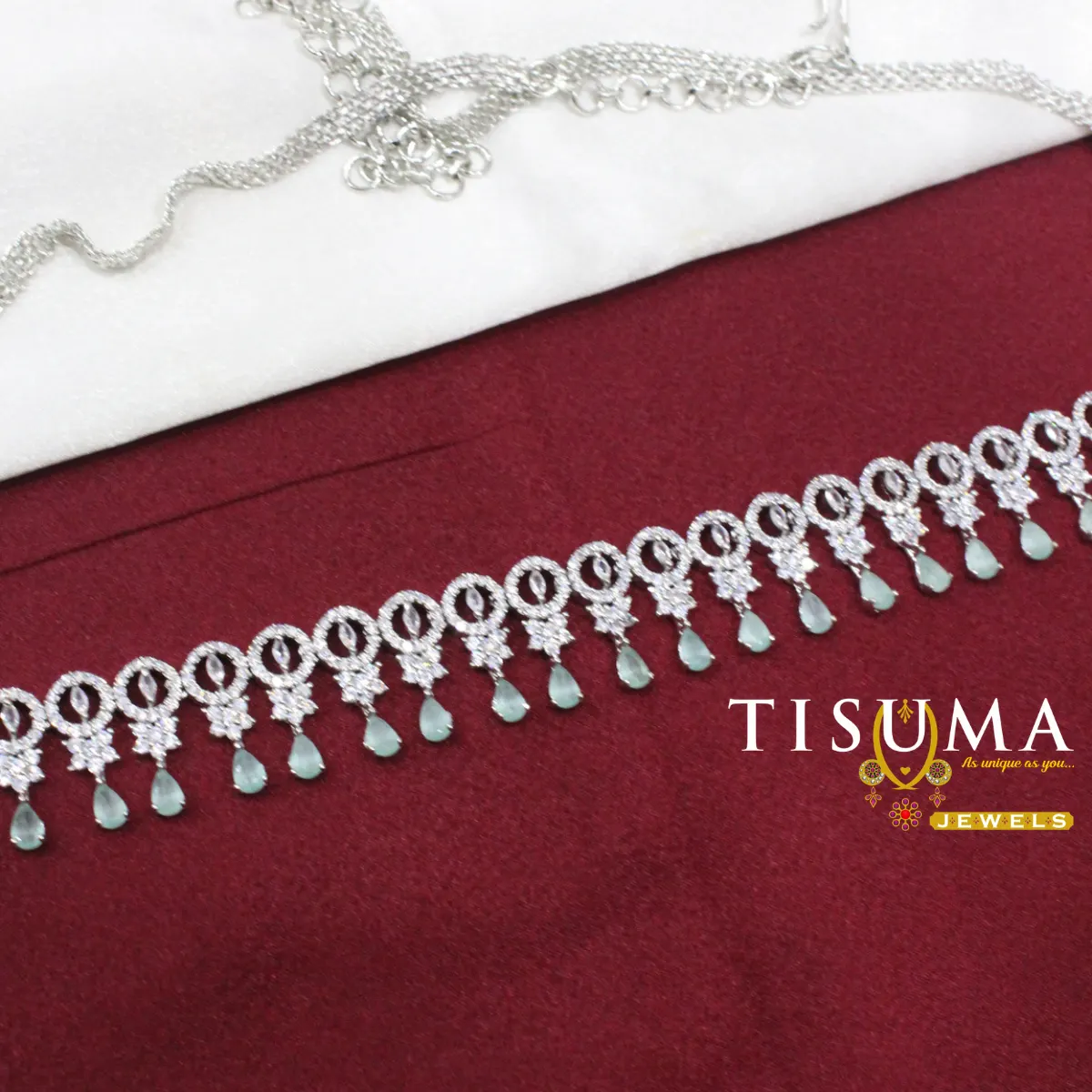 Silver-tone AD hip belt with circular stone motifs and mint green teardrop drops