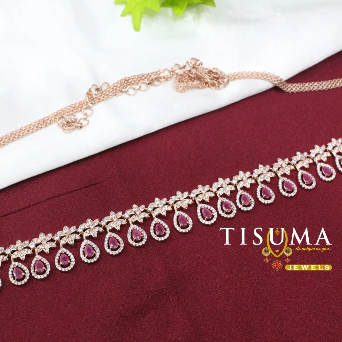 Rose gold-tone hip belt with floral AD-style stones and pink teardrop motifs