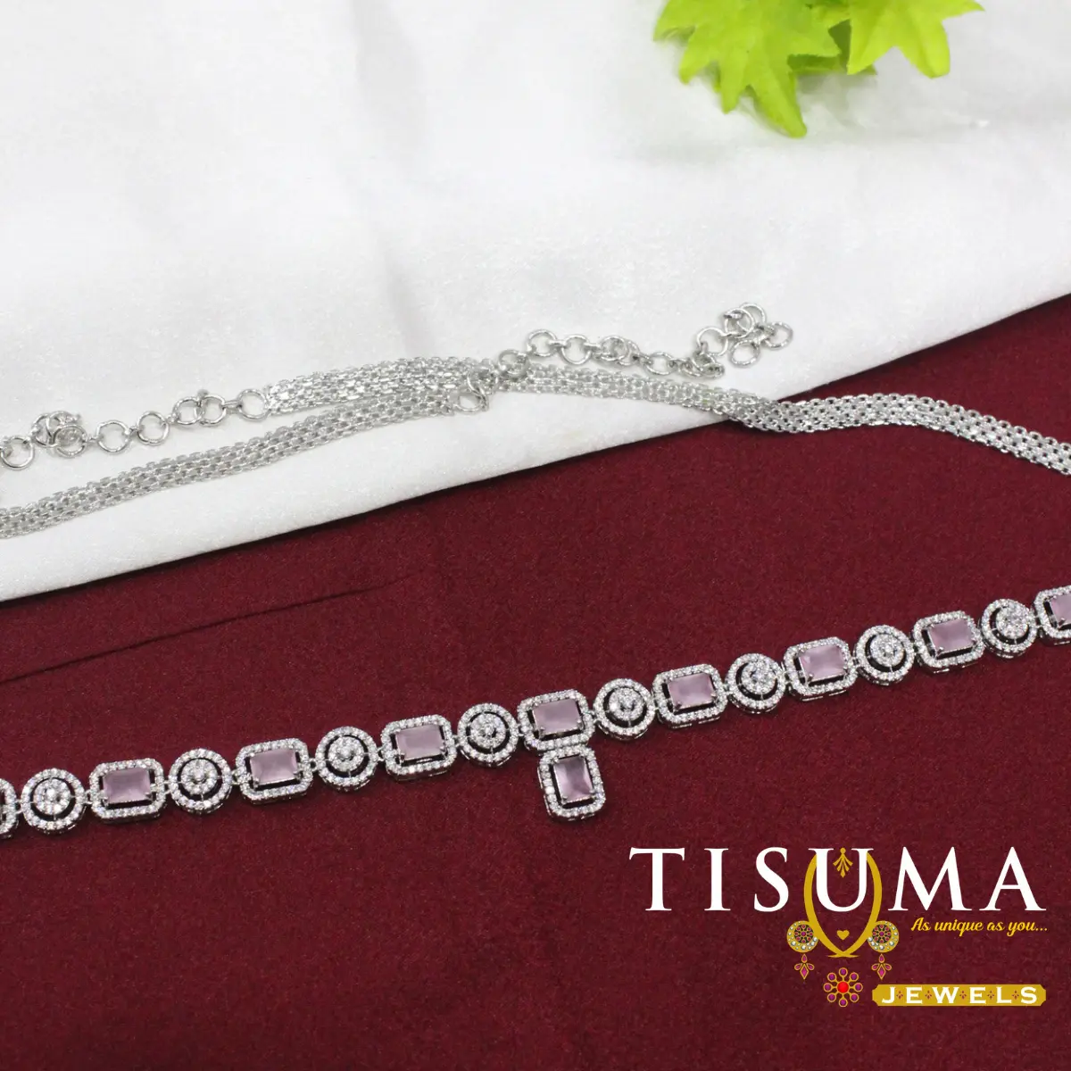 Silver-tone hip belt with rectangular light pink stones and circular AD-style motifs