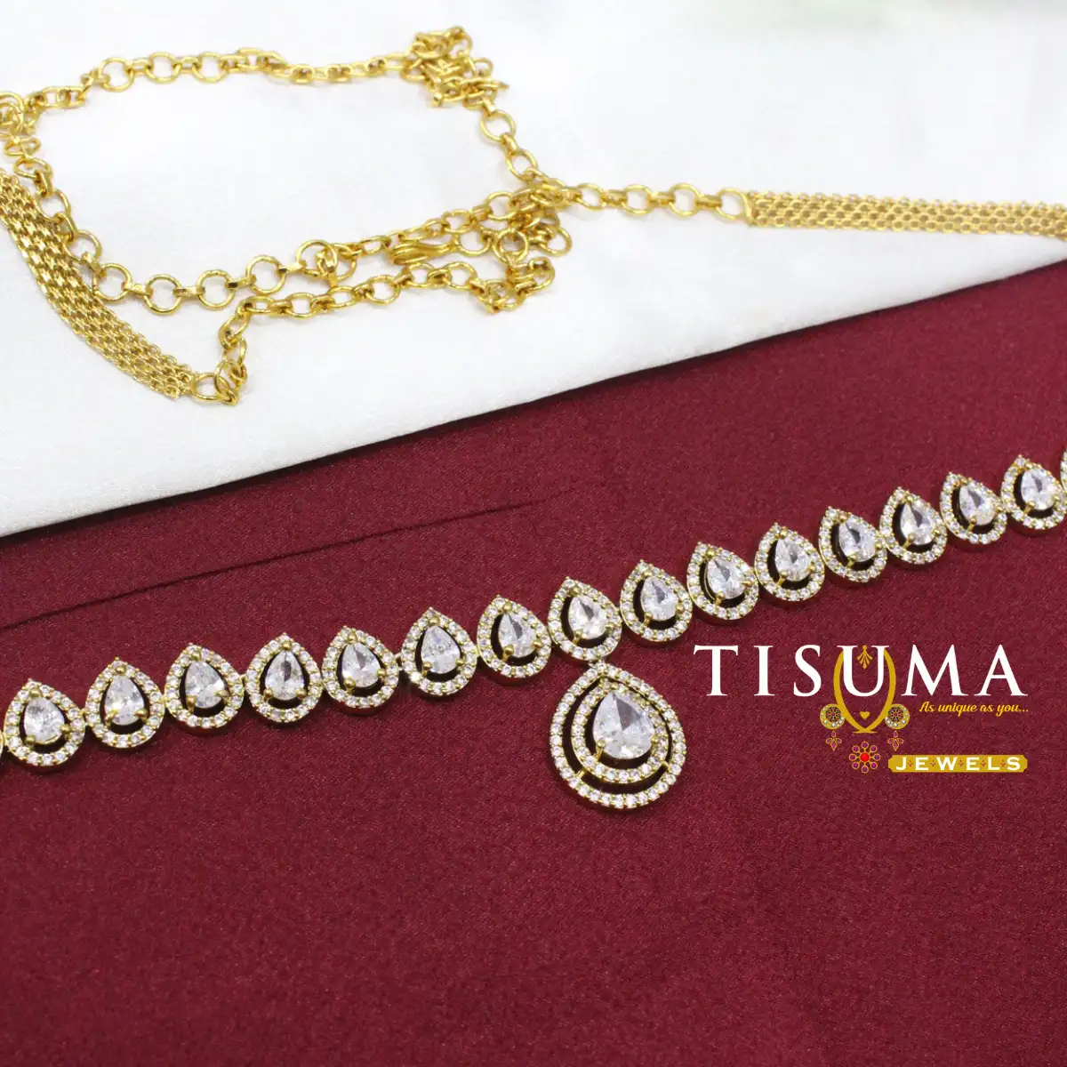Gold-tone hip belt with large clear teardrop stones and sparkling borders