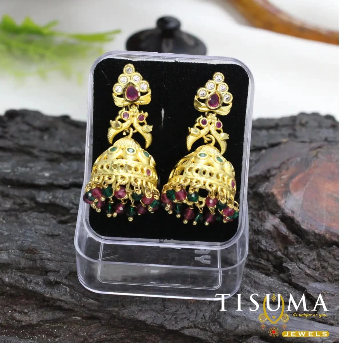 Gold-tone grand jhumka earrings with ruby pink green and white stone accents