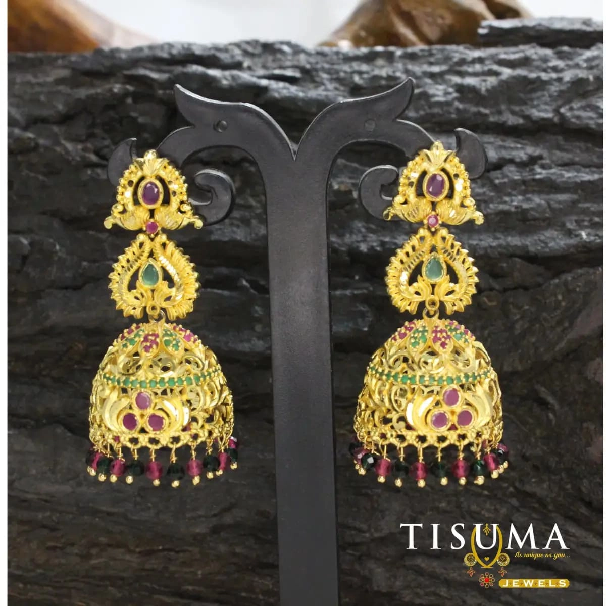 Gold-tone temple jhumka earrings with ruby pink and green stones and colourful bead drops