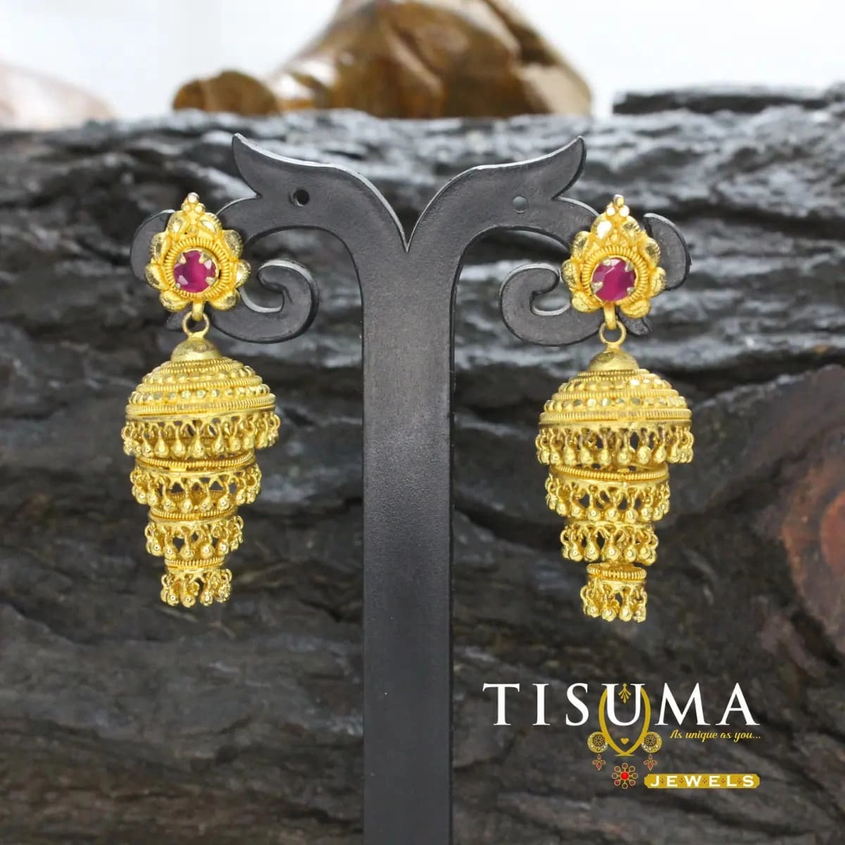 Gold-tone multi-layer temple jhumka earrings with ruby-pink centre stones