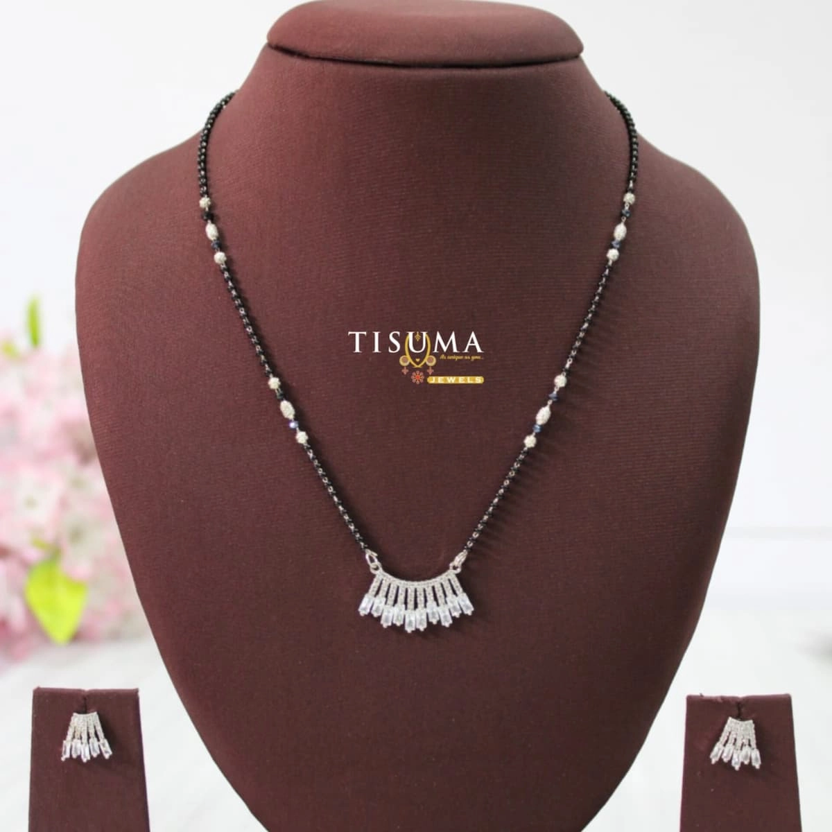 Black beads mangal sutra with fan-shaped AD pendant and matching earrings by Tisuma Jewels