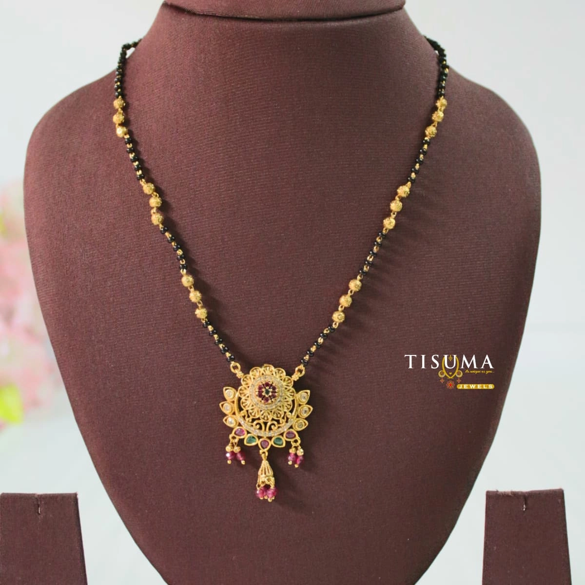 Gold-finish black beads mangal sutra with multicolor floral pendant and hanging drops