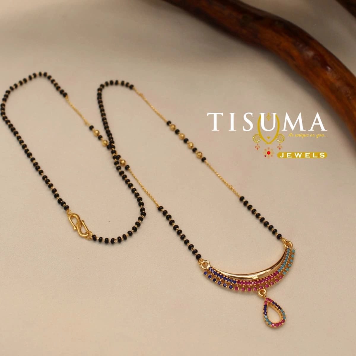 Multicolor AD stone mangal sutra with black beads and curved pendant