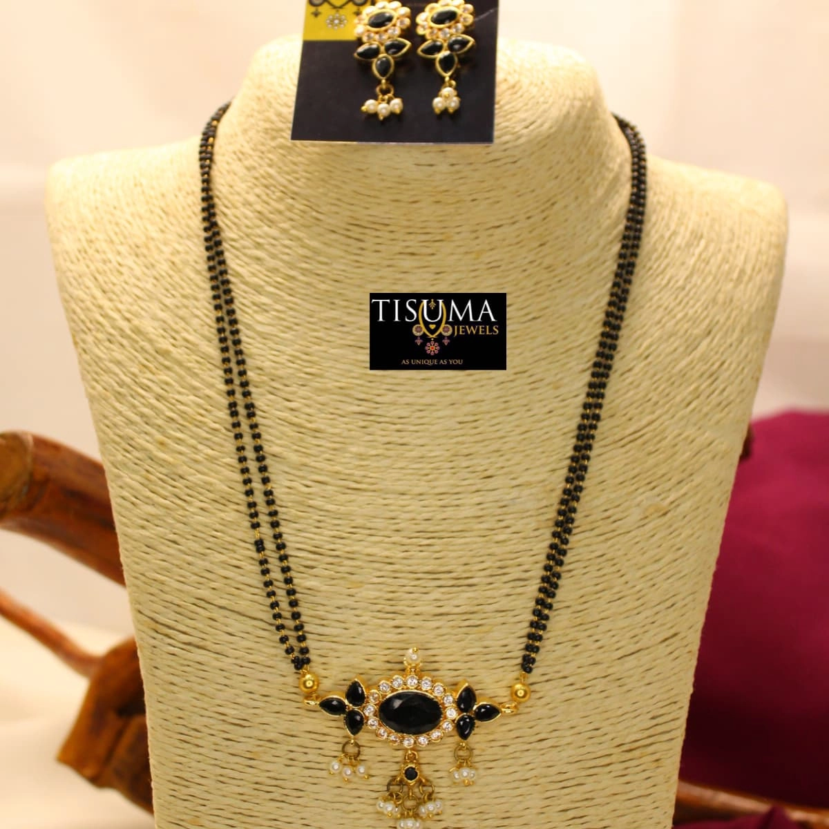 Double-line black beads mangal sutra with oval black stone AD pendant and pearl drops