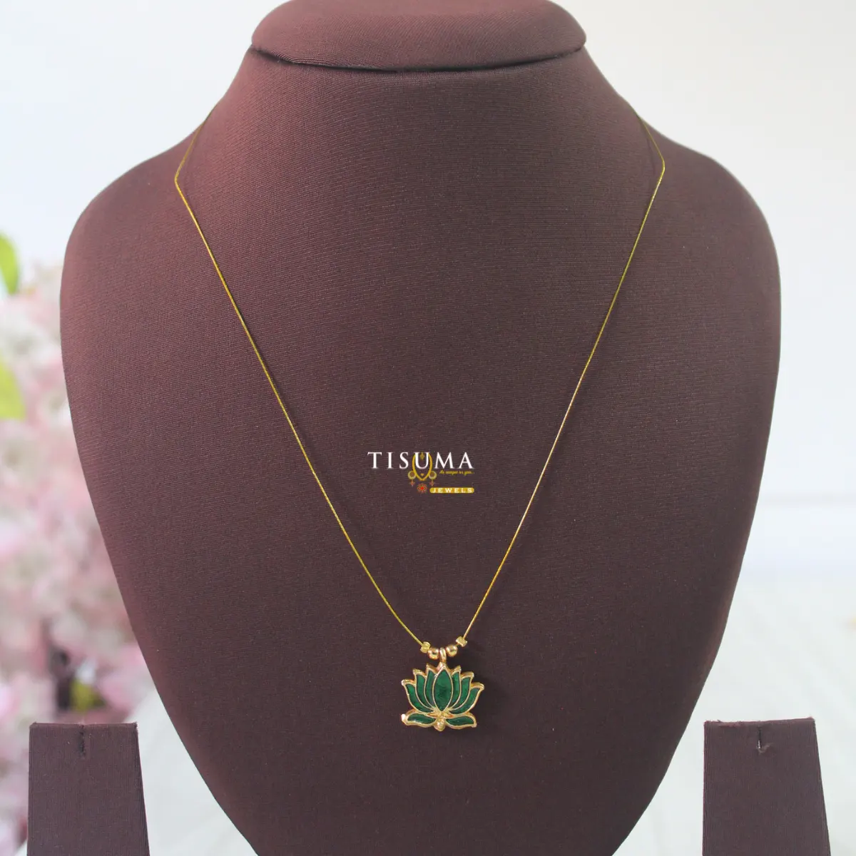 Gold-tone invisible chain with a green lotus flower pendant