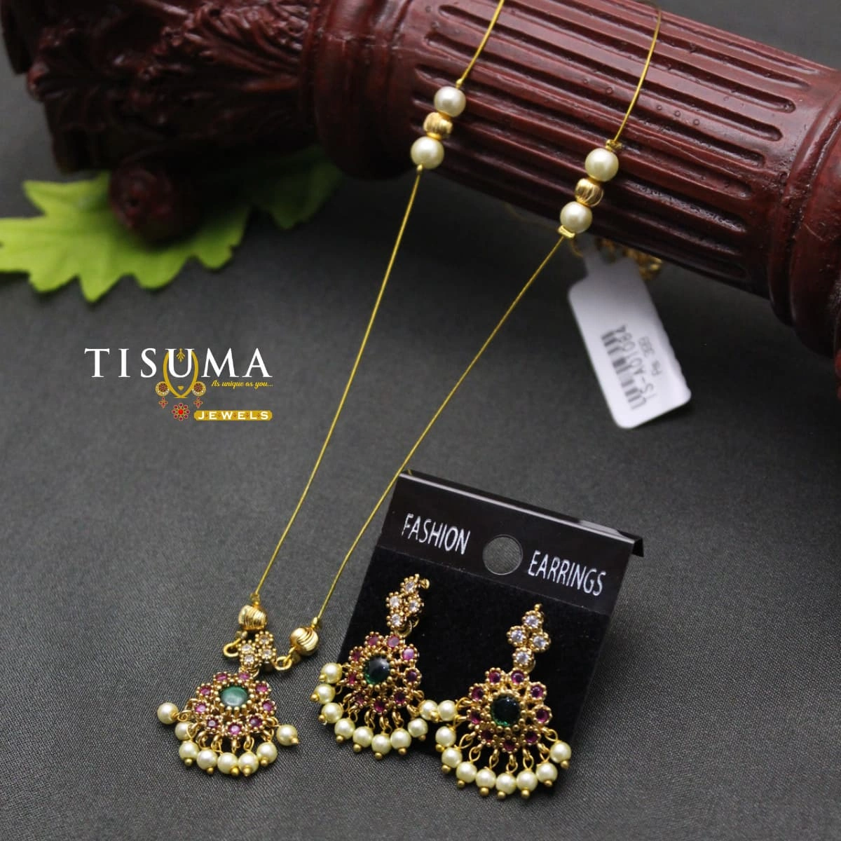 Gold-tone invisible chain set with ruby pink and green floral pendant and pearl-drop earrings