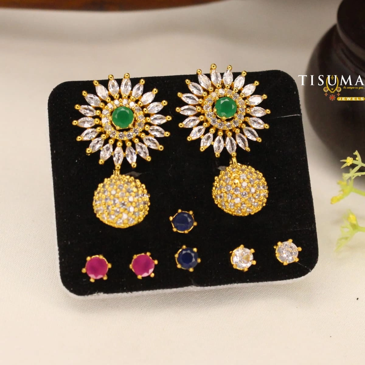 Green centre stone AD sunburst drop earrings with clear stones and gold-tone finish