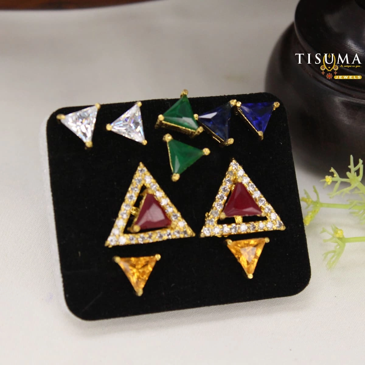 Ruby-red triangular AD stud earrings with clear stone borders and multicolour triangle accents