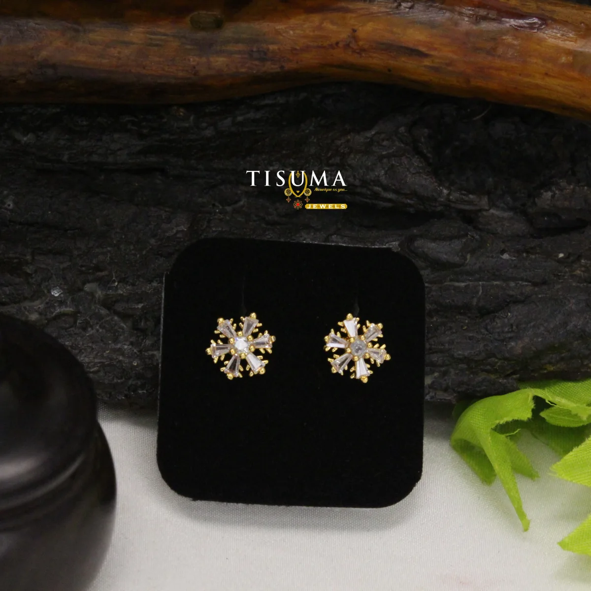 Gold-tone floral AD stud earrings with clear baguette-style stones