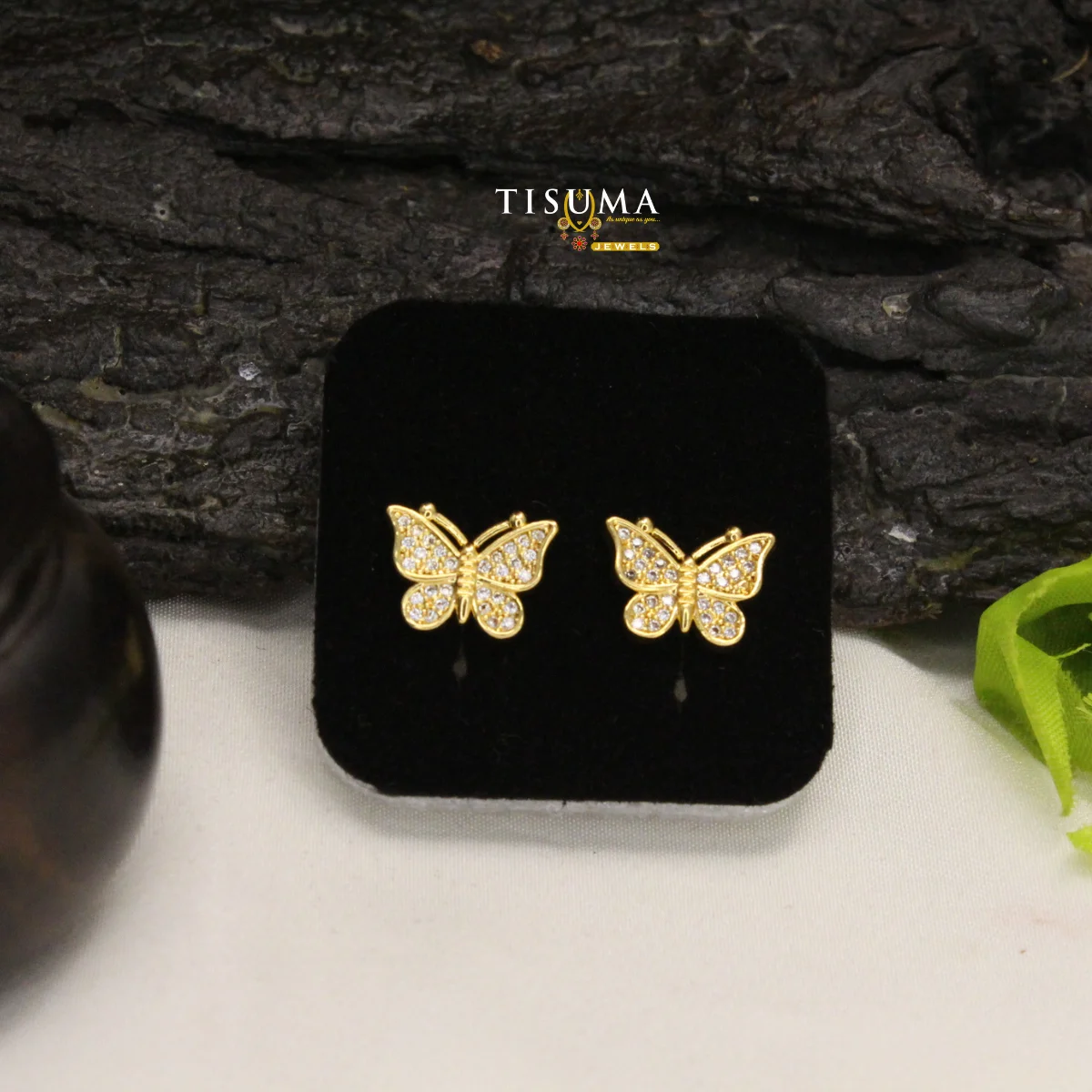 Gold-tone butterfly stud earrings decorated with clear sparkling stones