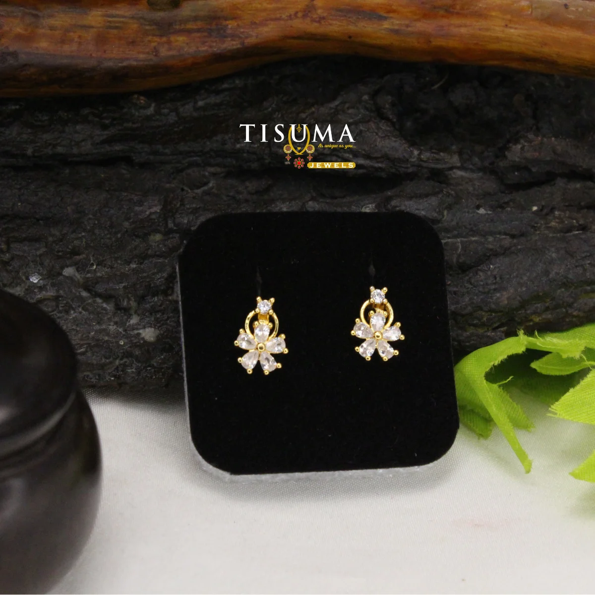 Gold-tone floral drop stud earrings with clear marquise-shaped stones