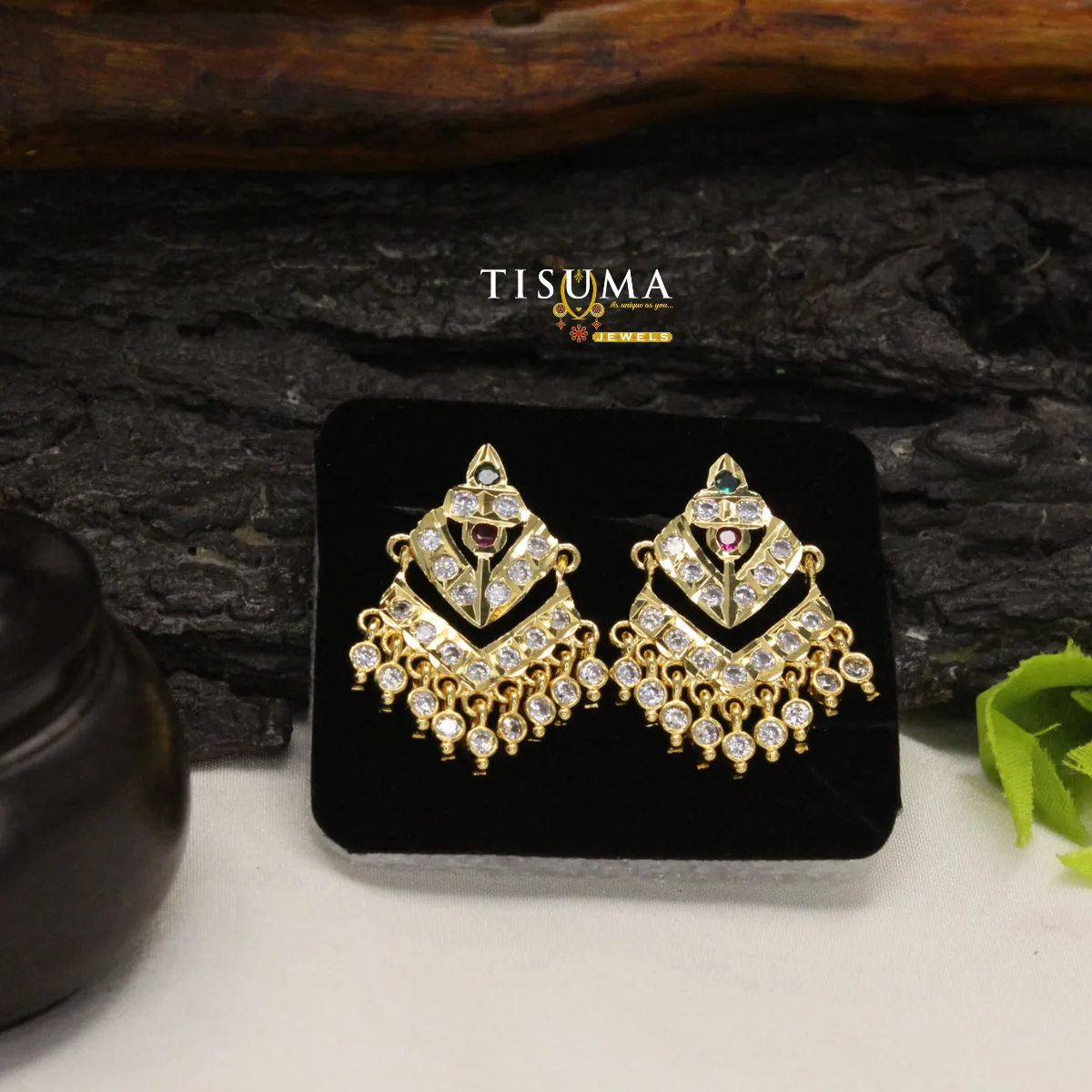 Gold-tone geometric chandbali earrings with white stones and ruby-red accents