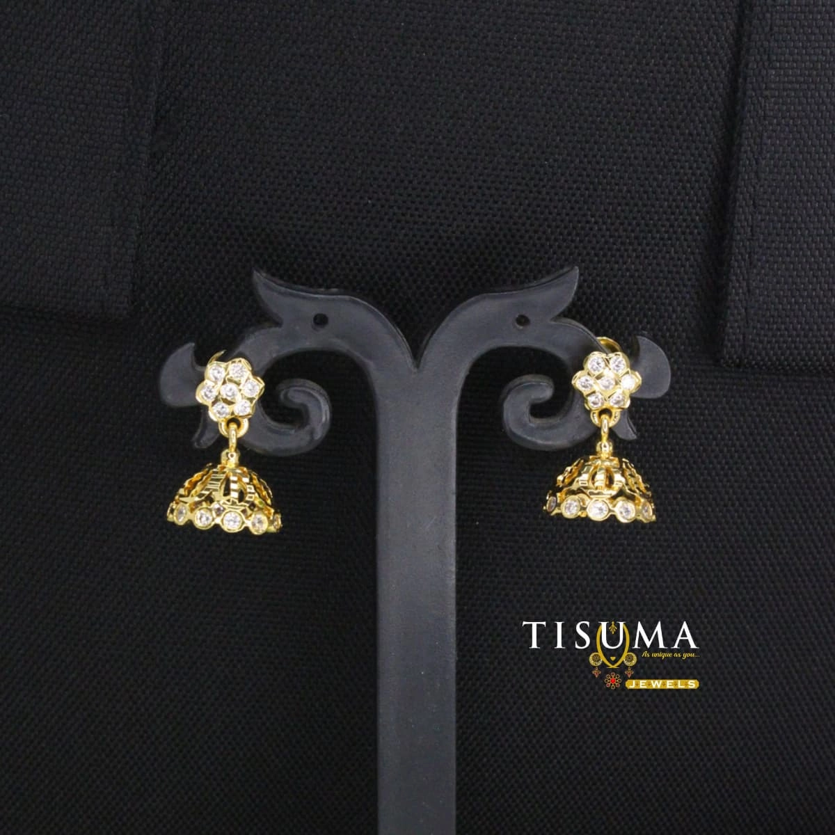Gold-tone floral stud jhumka earrings with white stones and dome-shaped drops