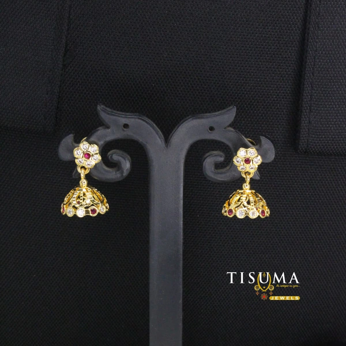 Gold-tone floral jhumka earrings with ruby-red accents, white stones and dome drops
