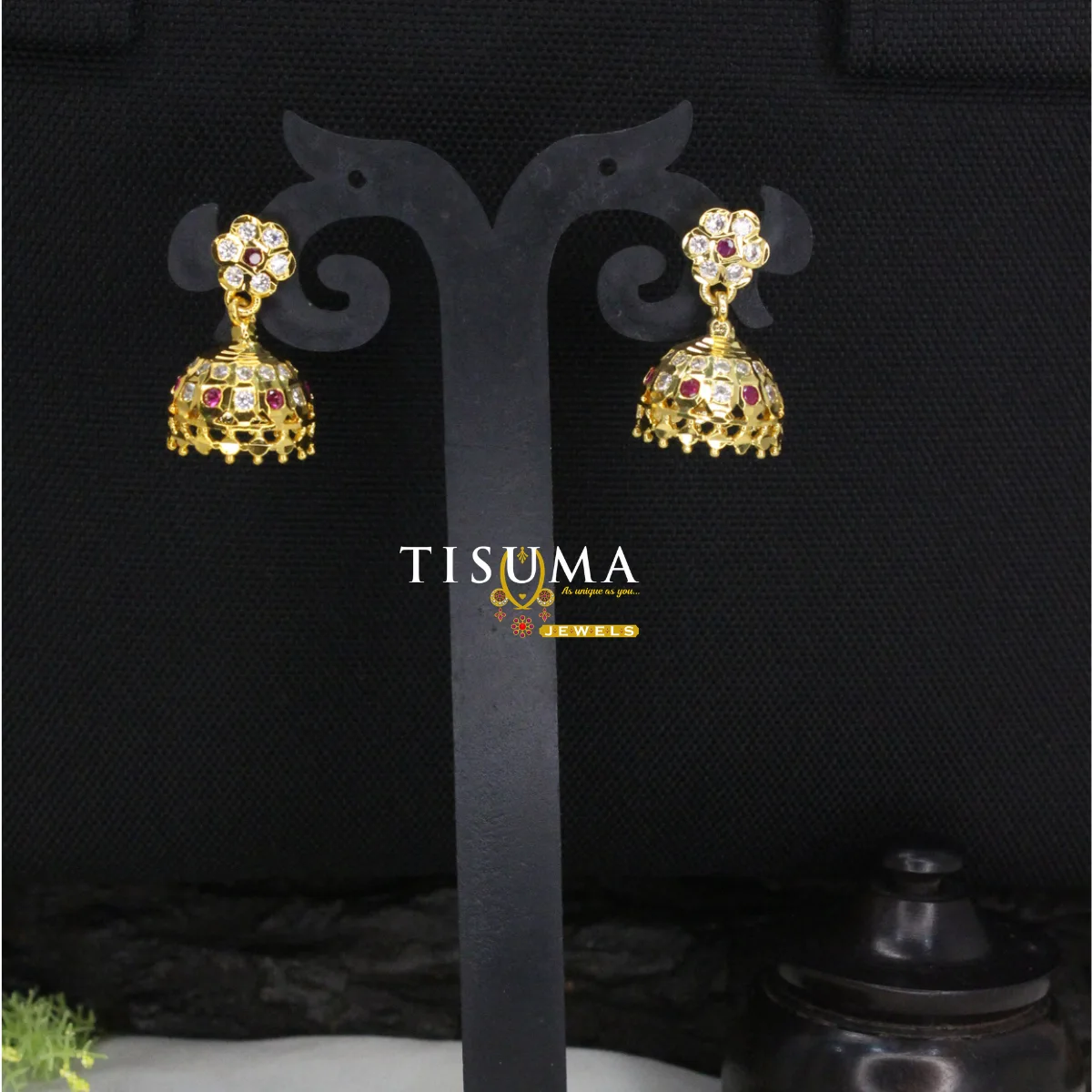 Gold-tone floral jhumka earrings with ruby-colour and white stones and decorative dome detailing