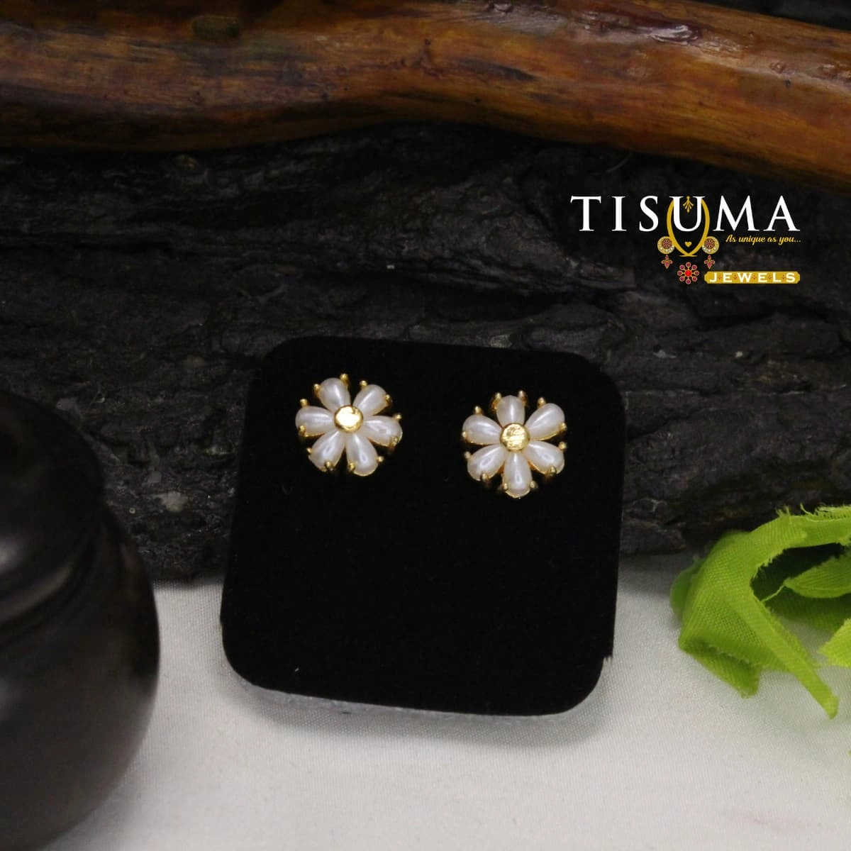 White pearl-look flower stud earrings with gold-tone centres