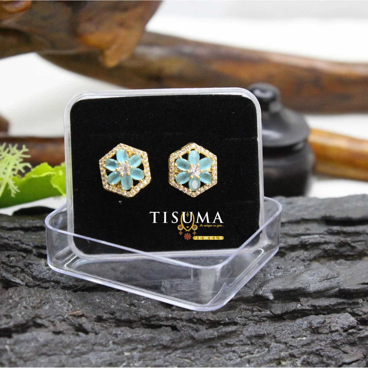 Aqua blue floral hexagon stud earrings with white AD-style stone border and gold-tone finish