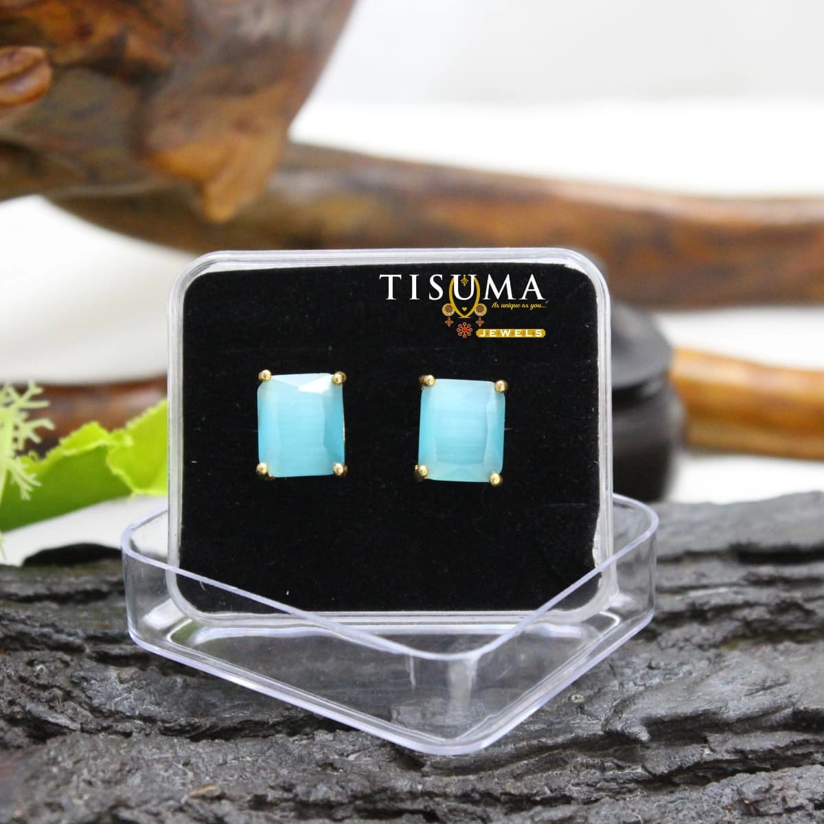 Aqua blue rectangular stone stud earrings with gold-tone prong setting