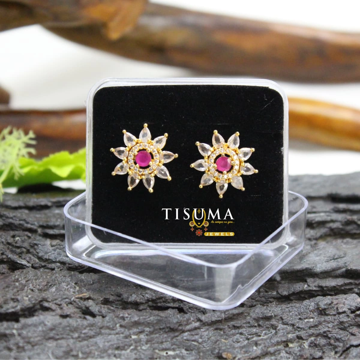 Ruby-pink floral sunburst stud earrings with white marquise-shaped stones and gold-tone detailing