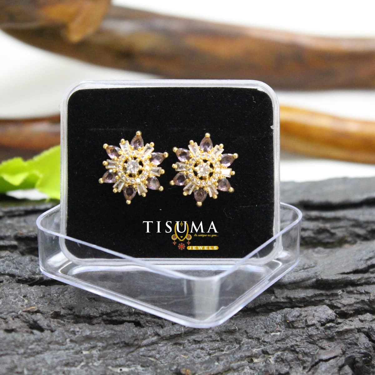 Light purple floral sunburst stud earrings with white AD-style stones and gold-tone detailing