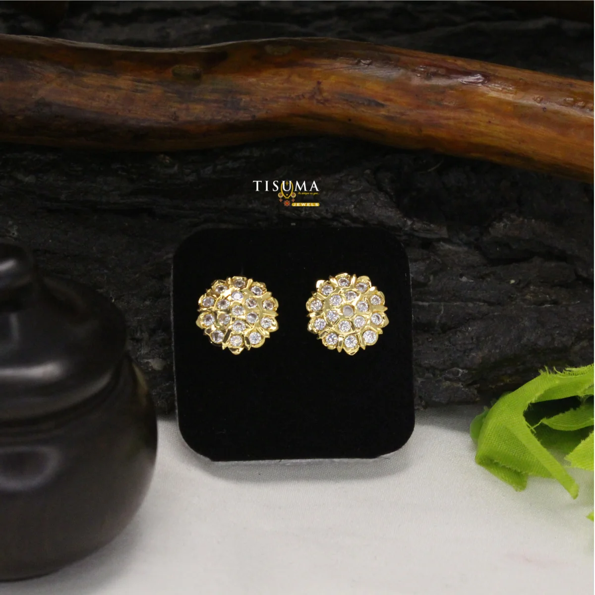Round gold-tone stud earrings featuring multiple white stones in a cluster design