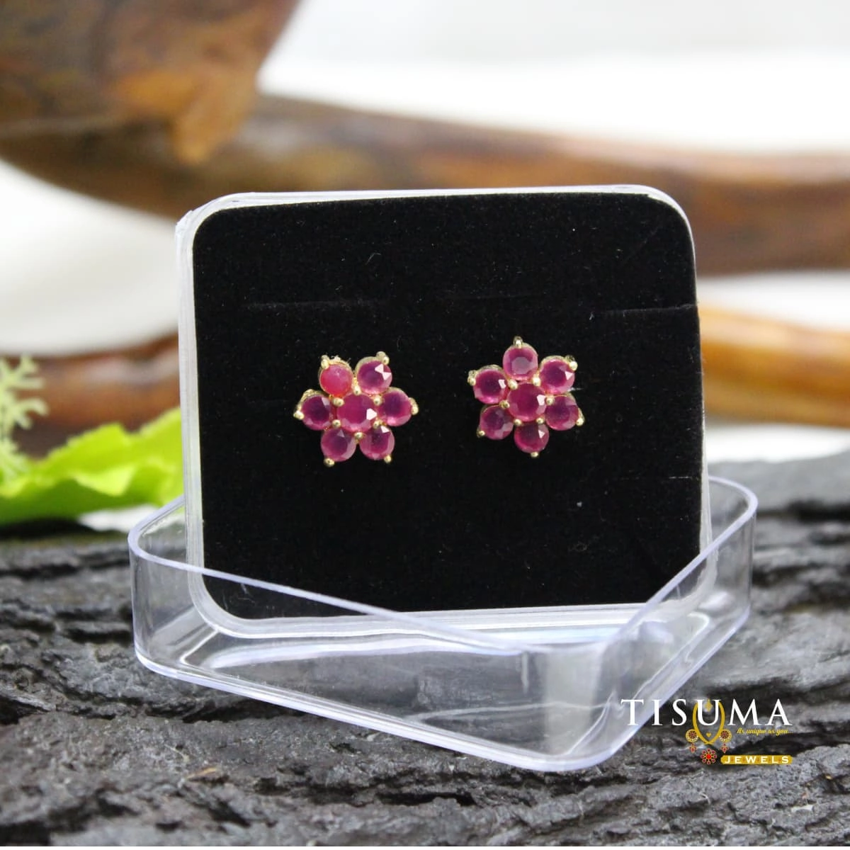 Ruby pink floral stud earrings with gold-tone setting