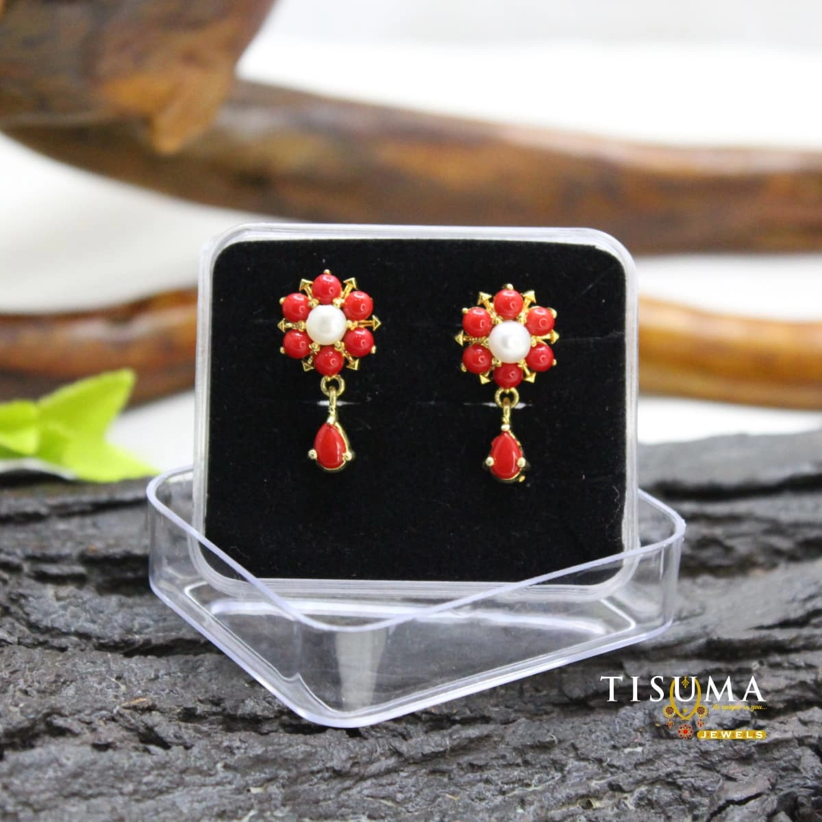 Red floral drop earrings with white pearl-style centre and teardrop accents