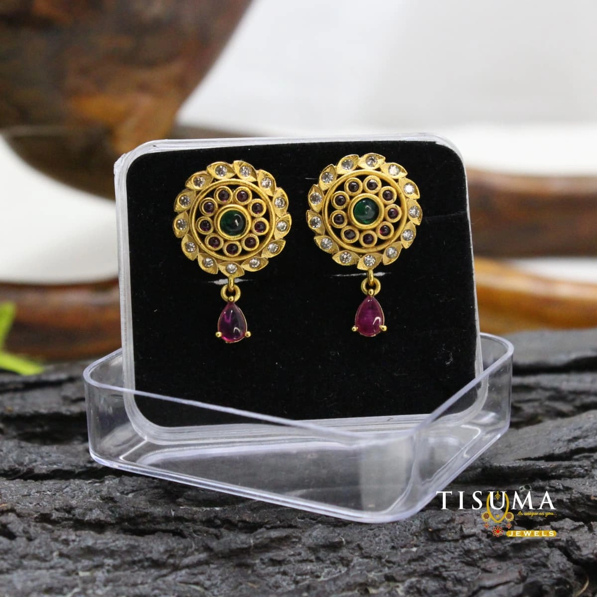Traditional gold-tone round earrings with green centre stones, clear stone detailing and purple teardrop accents