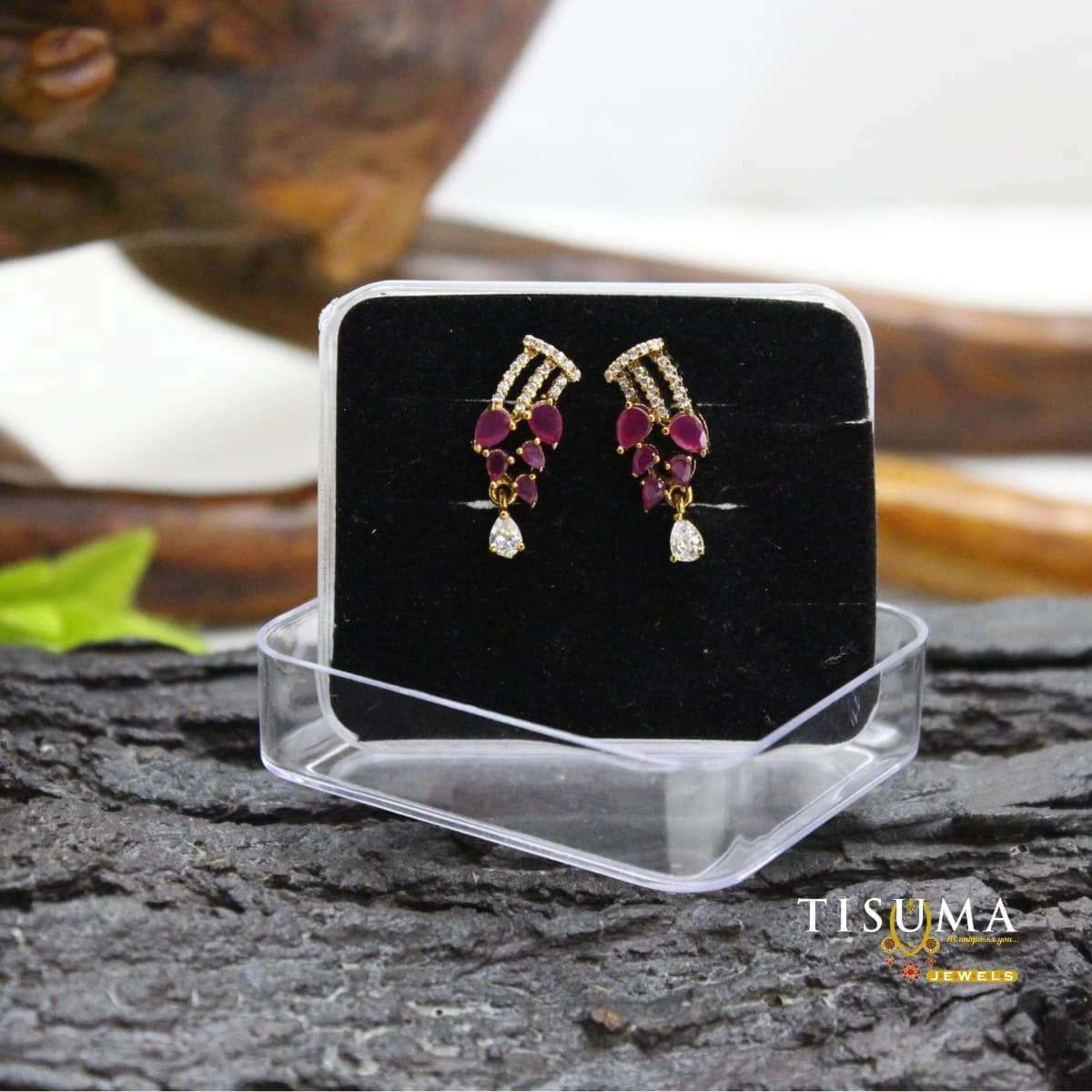 Gold-finish ruby-pink stone drop earrings with white AD stones and teardrop accents
