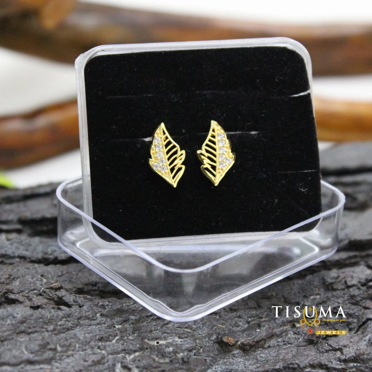 Gold-finish leaf design AD stud earrings with clear stones from Tisuma Jewels
