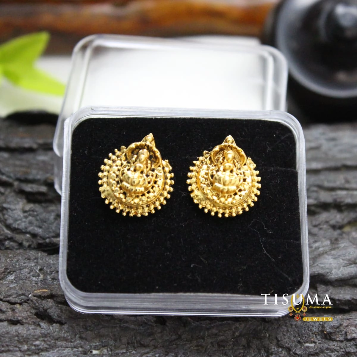 Antique gold Lakshmi-inspired temple stud earrings with intricate traditional detailing