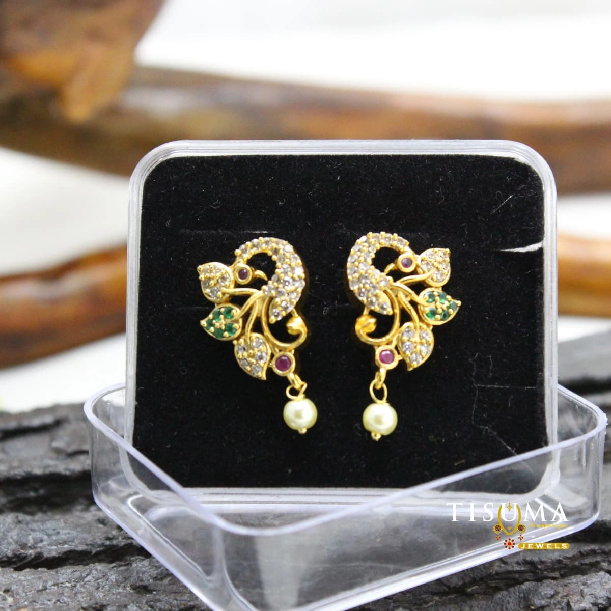 Peacock design AD earrings with green and pink stones and pearl drops