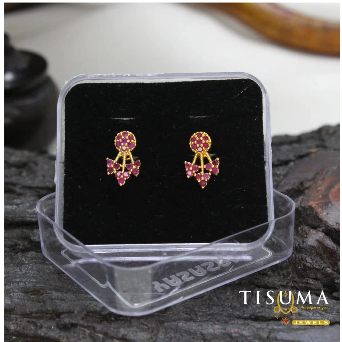 Gold-tone drop stud earrings with round pink stones and floral-inspired detailing