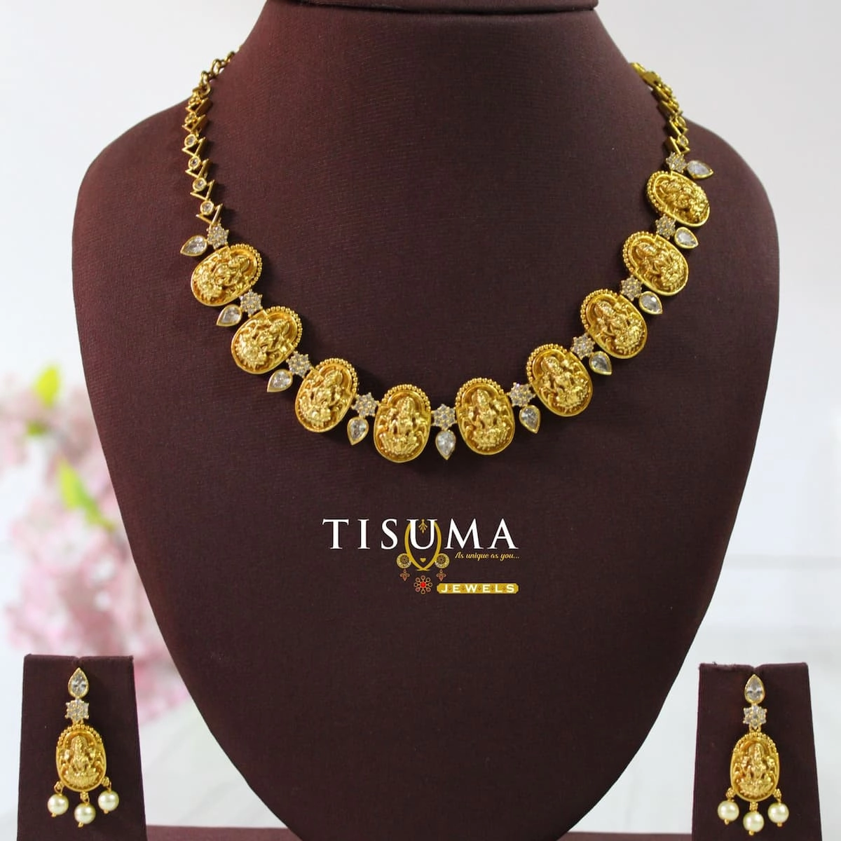 Traditional gold finish Lakshmi coin necklace with white stone accents and matching pearl drop earrings – Tisuma Jewels