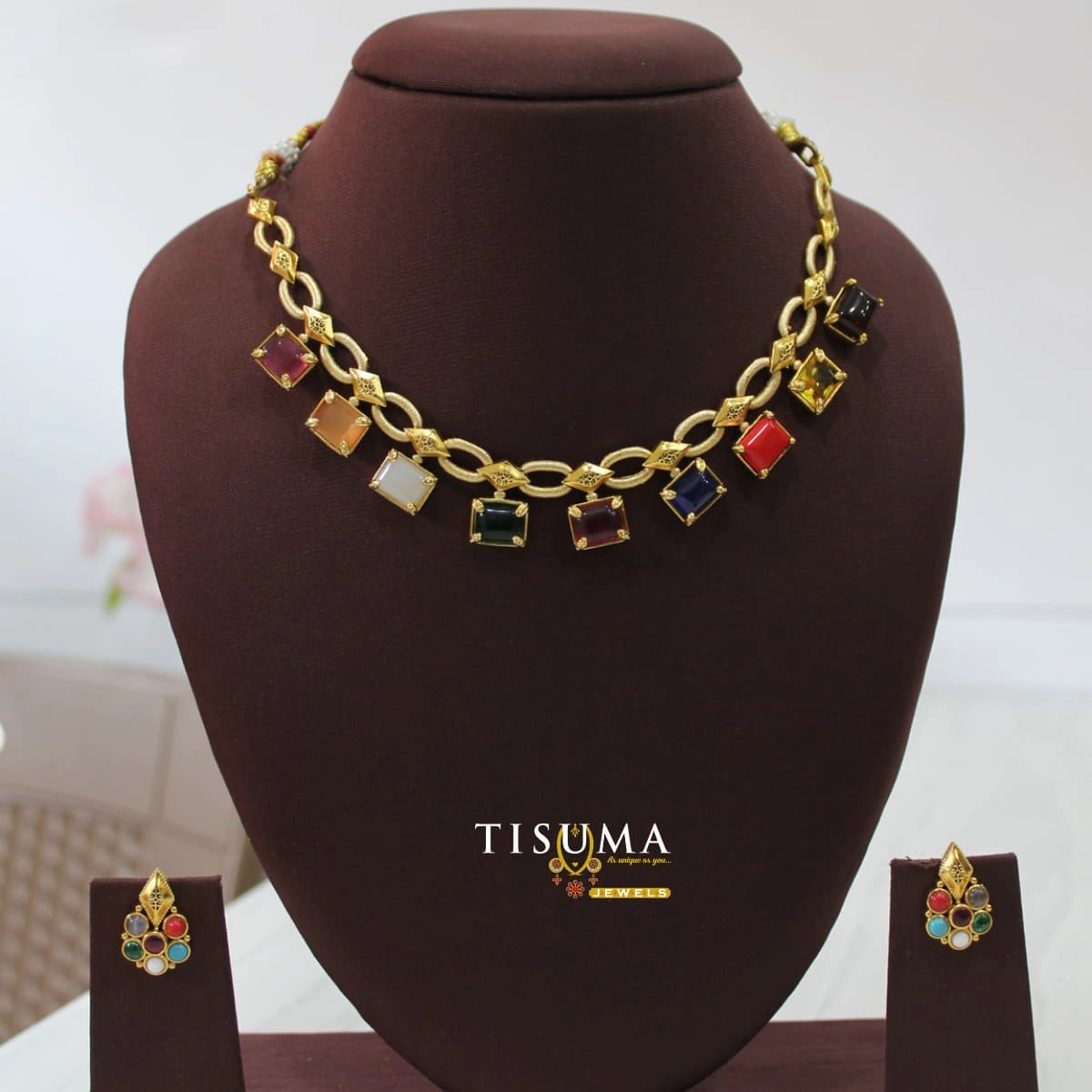 Multicolor stone gold finish necklace set with geometric link design and matching earrings – Tisuma Jewels.