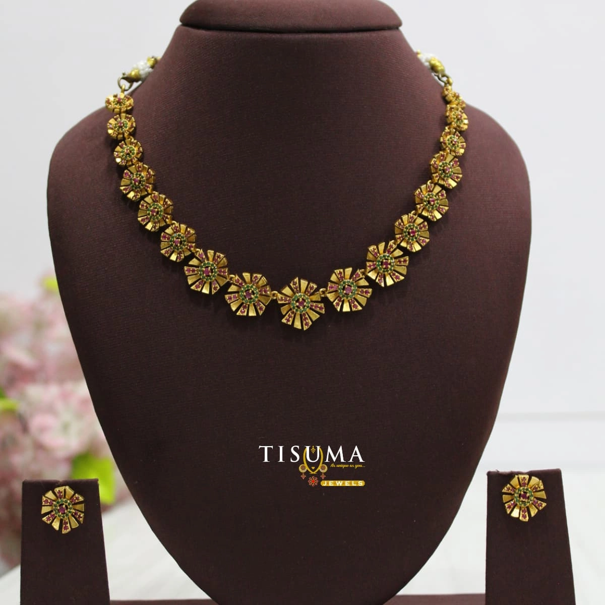 Antique gold floral necklace set with pink and green stone accents and matching earrings