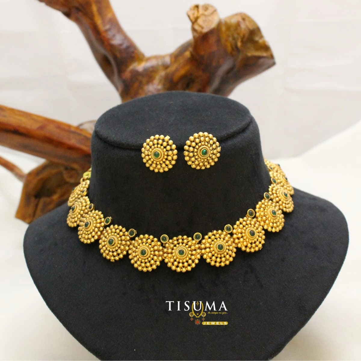Traditional gold-tone matte necklace set with circular beaded motifs, green stone accents and matching stud earrings | Tisuma Jewels