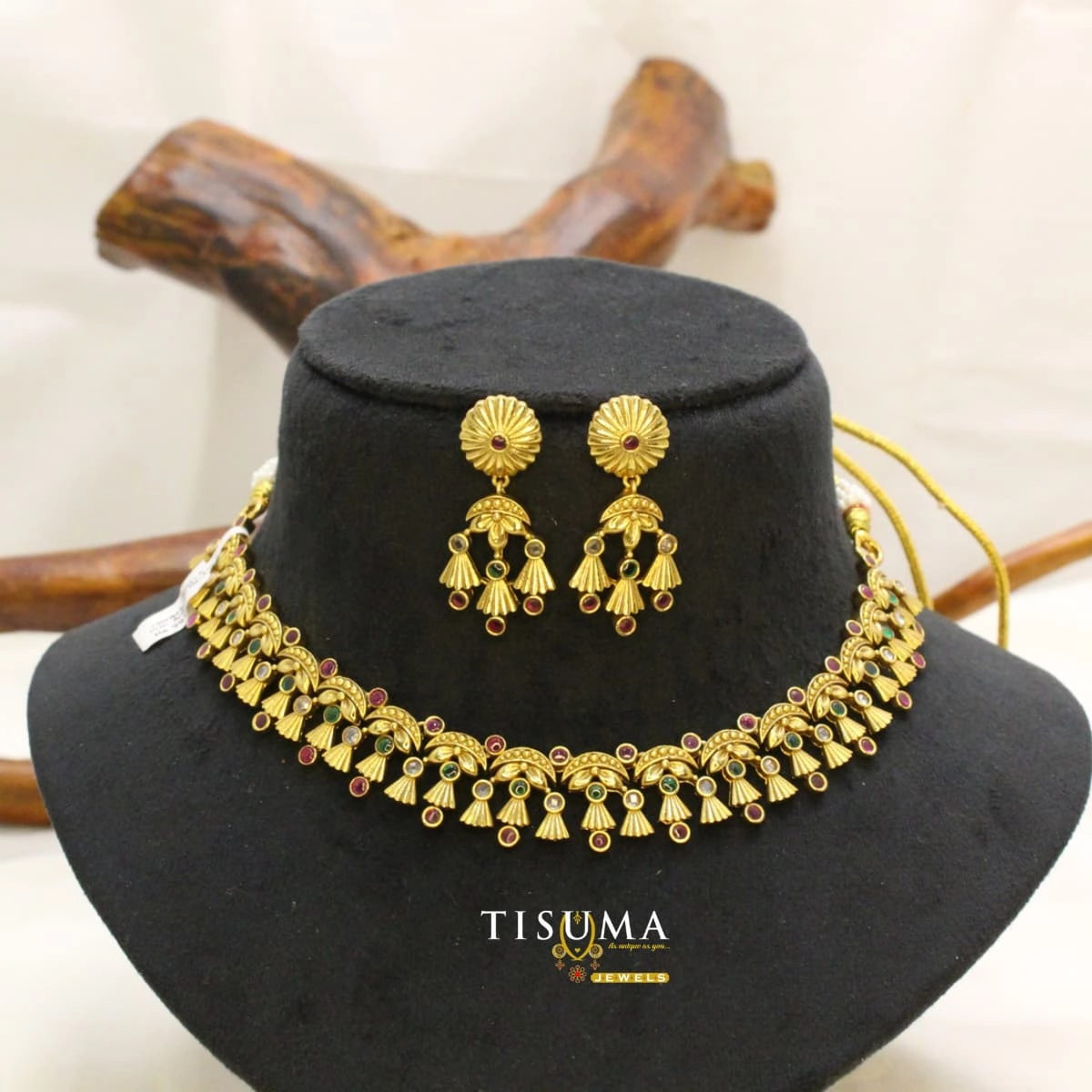 Traditional antique gold-tone necklace set with green, ruby red and white stone accents, floral motifs and matching earrings | Tisuma Jewels