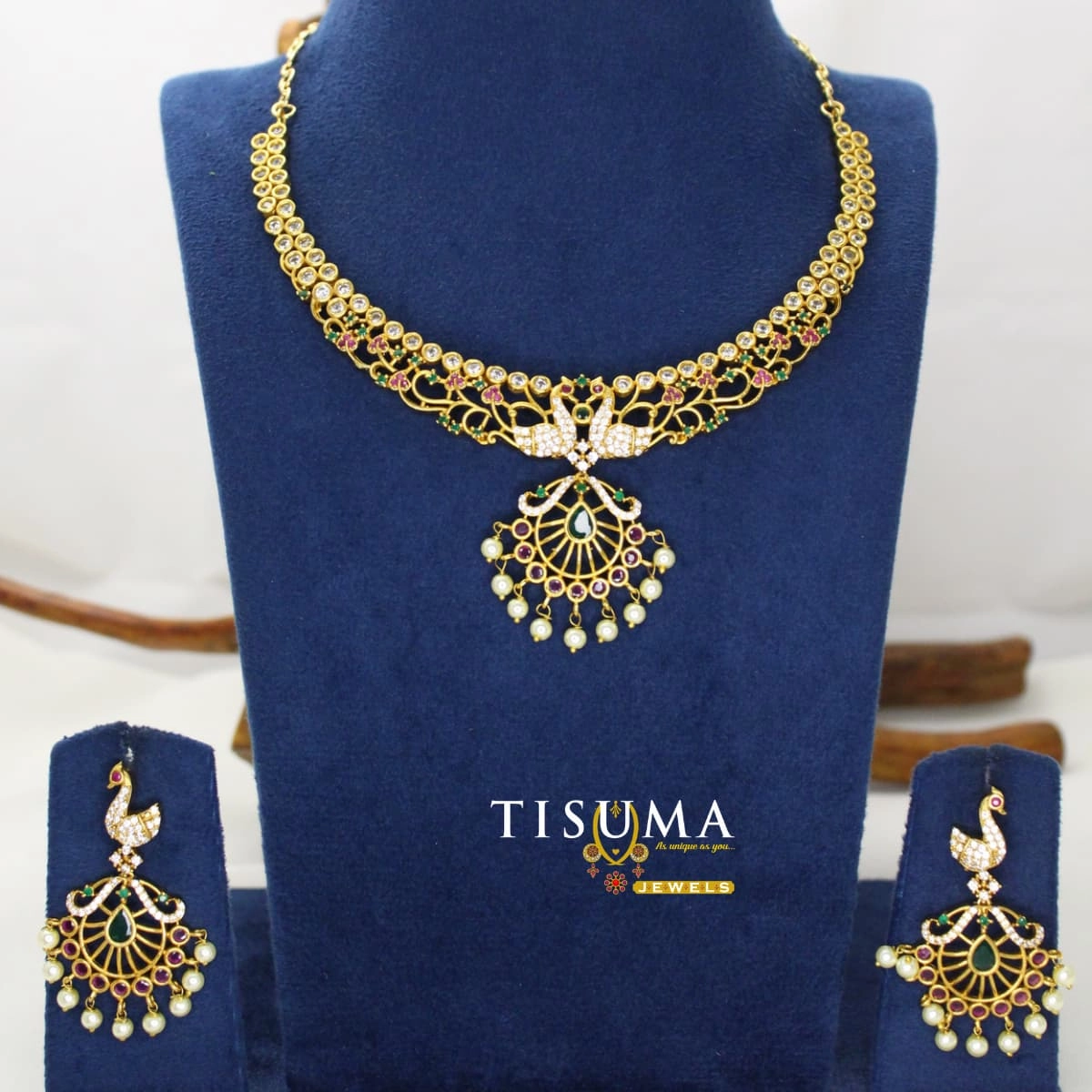 AD peacock pendant necklace set with colourful stones, circular fan design and pearl drops with matching earrings | Tisuma Jewels
