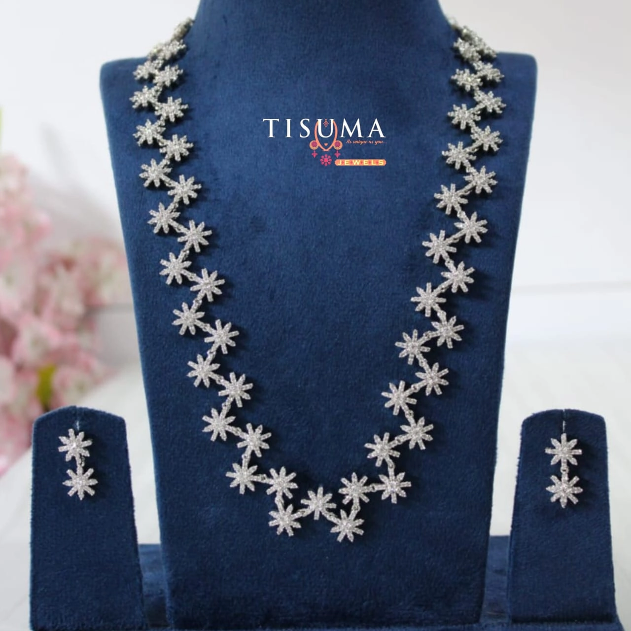 Silver-tone AD necklace with sparkling floral starburst motifs and matching earrings