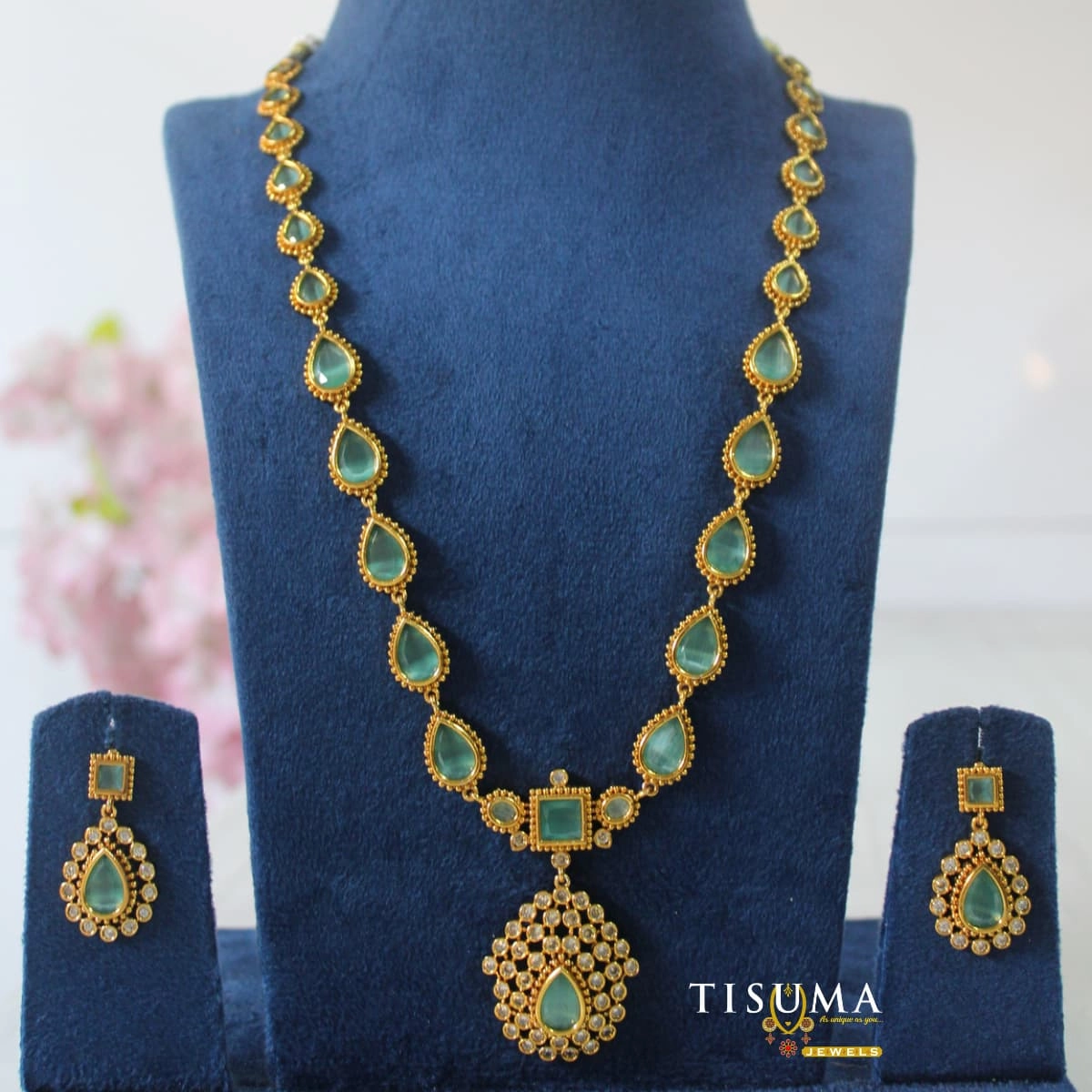 Tisuma Jewels gold plated long haram necklace with green teardrop stones and statement pendant