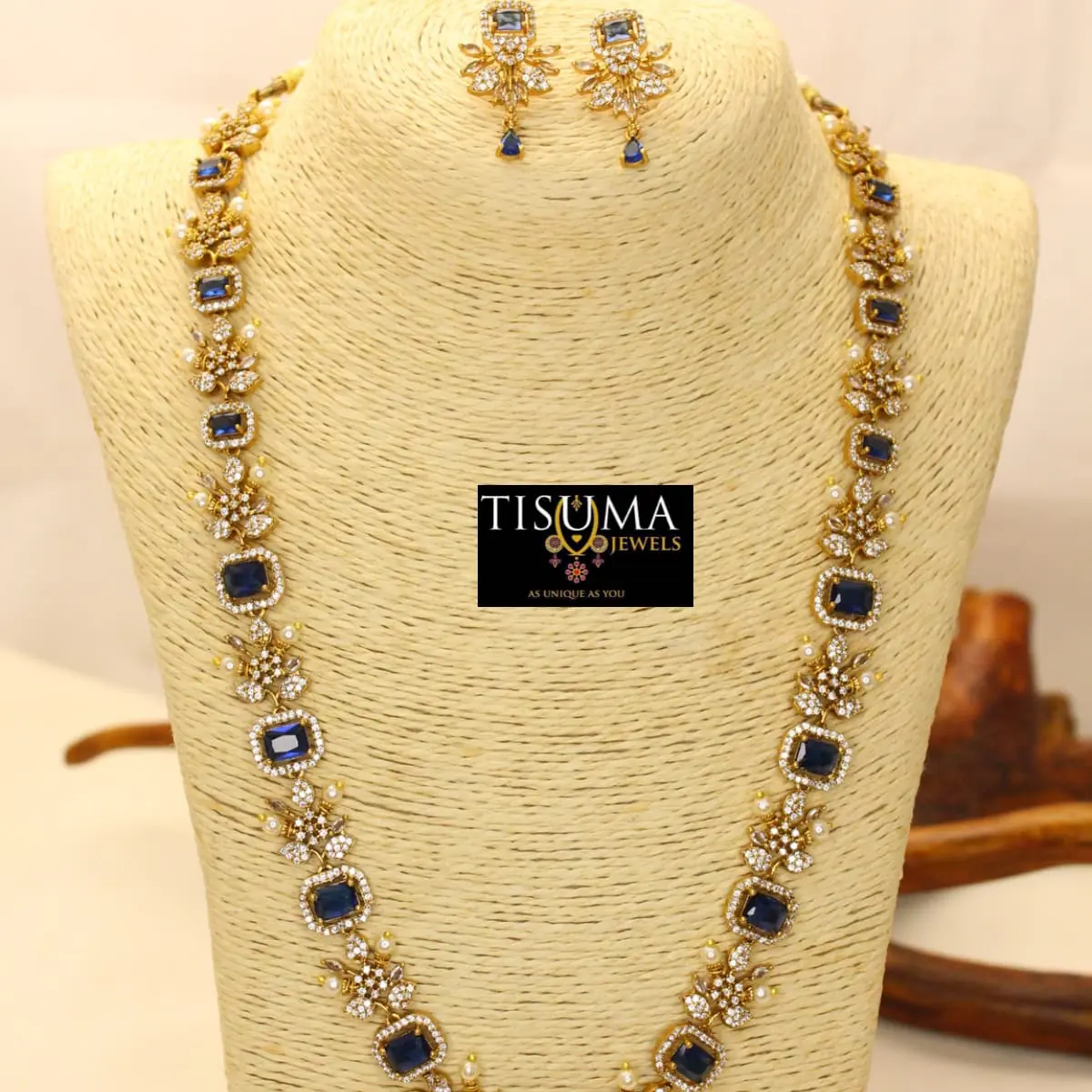 Tisuma Jewels traditional gold haram necklace set with blue stones, floral CZ detailing, pearl accents and matching earrings