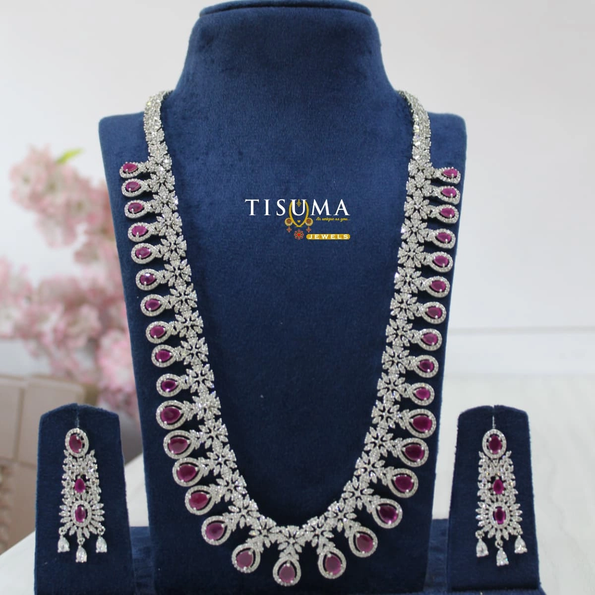 Pink stone AD silver haram necklace set with teardrop motifs and matching earrings