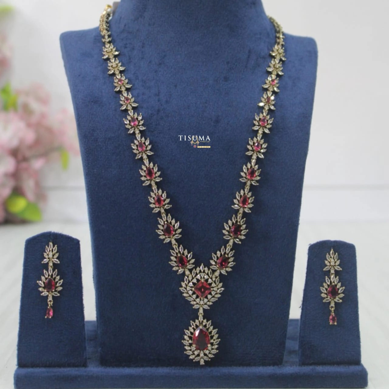 Victorian haram necklace set with ruby red stones, gold tone floral leaf detailing and matching earrings