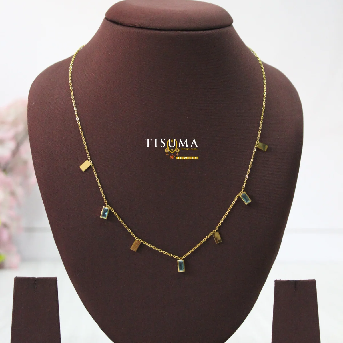 Gold-Tone Charm Necklace with Rectangular Blue Stone and Geometric Gold Accents – Tisuma Jewels