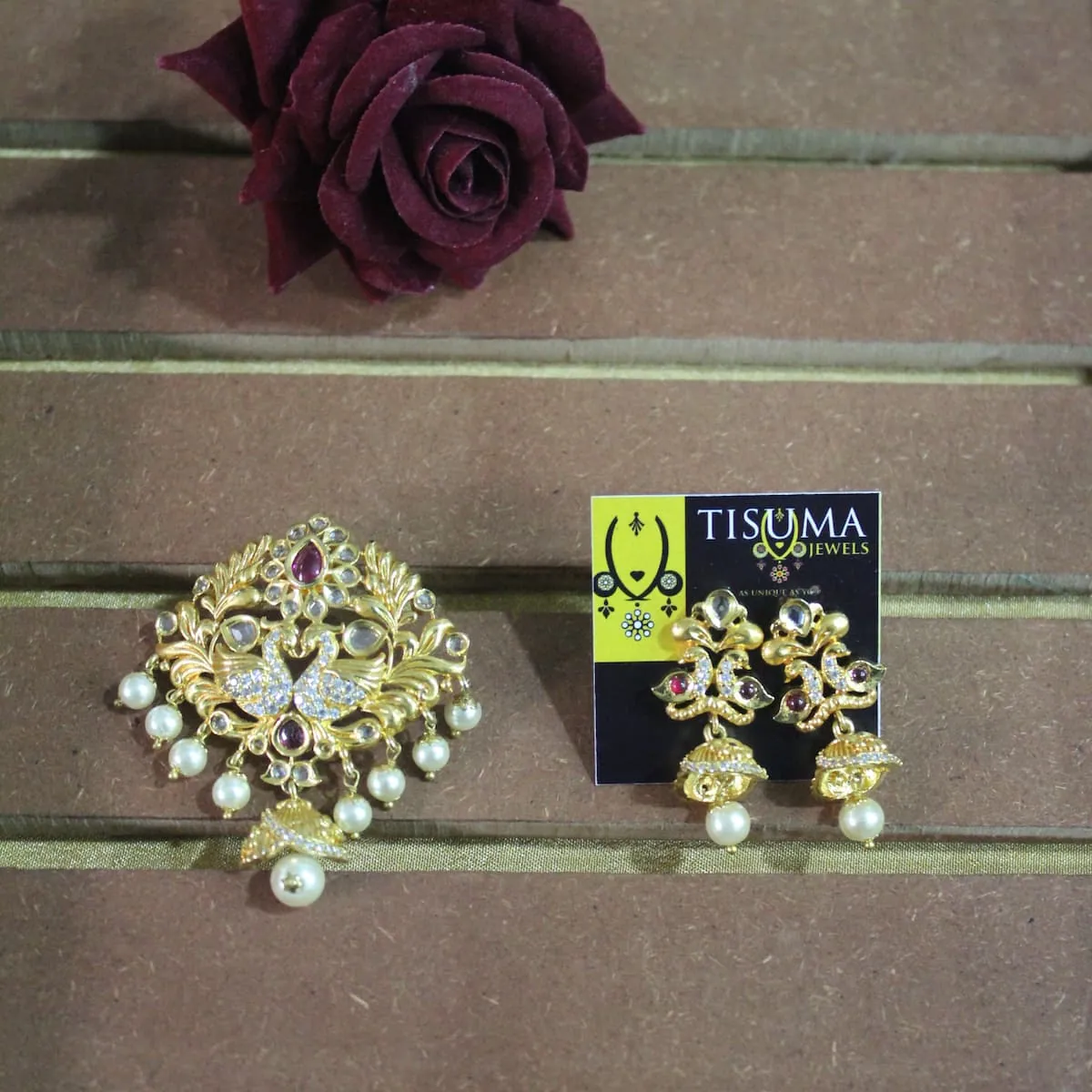 Traditional peacock pendant with matching gold-tone earrings and white pearl drops by Tisuma Jewels