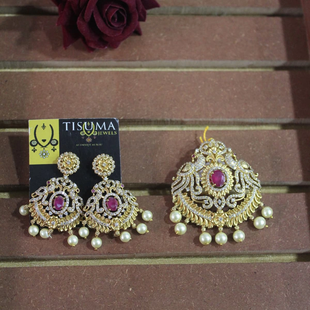 Traditional ruby stone pendant with matching gold-tone earrings and white pearl drops by Tisuma Jewels